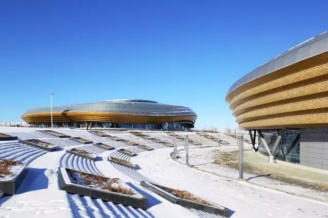 梅洪元丝路花谷孕育寒地建筑第十三届全国冬季运动会冰上运动中心