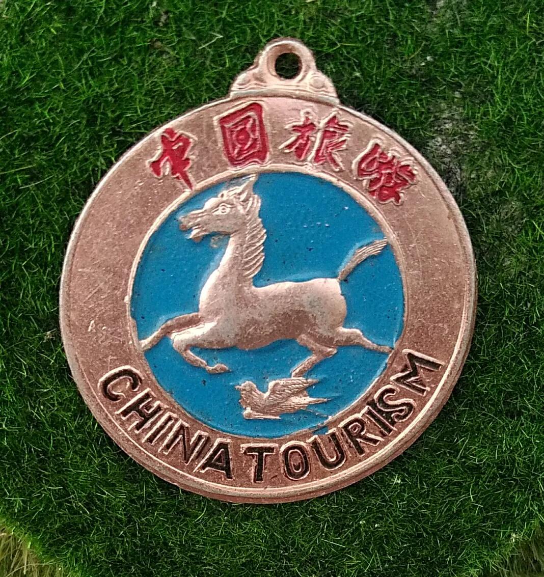 中国旅游日马踏飞燕的由来,什么是马踏飞燕徽标