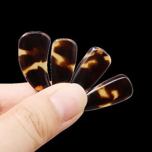 什么材质的古筝指甲音色好,古筝义甲材质