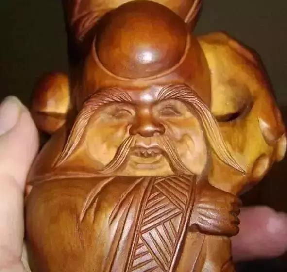 木雕兽头什么寓意,长颈鹿木雕婚礼摆件有什么寓意