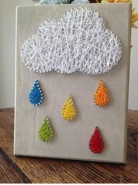 用绳子做绕线画,一根线吊起来拴着笔画画