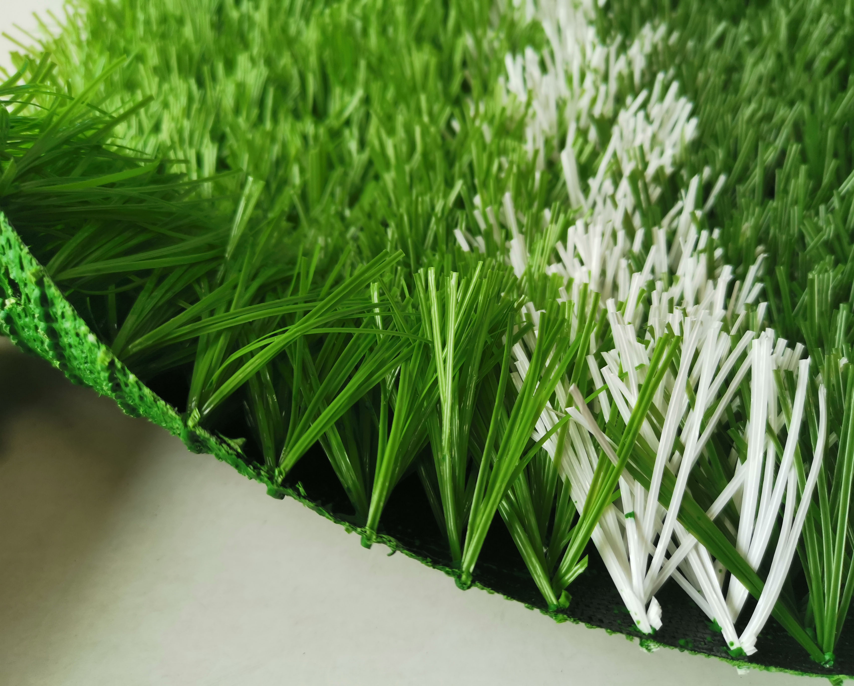 足球场假草皮价格多少钱一平方,足球场假草皮铺设流程