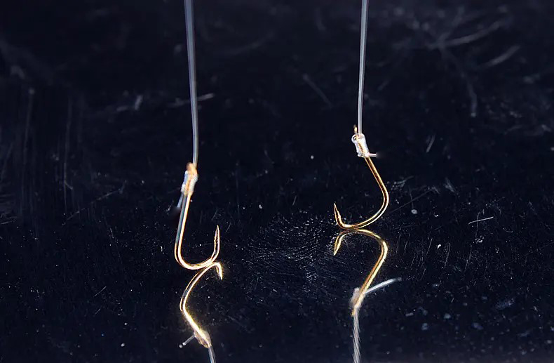 绑鱼钩的位置放在前面还是后面好,绑鱼钩时钩条粗细和线的比例