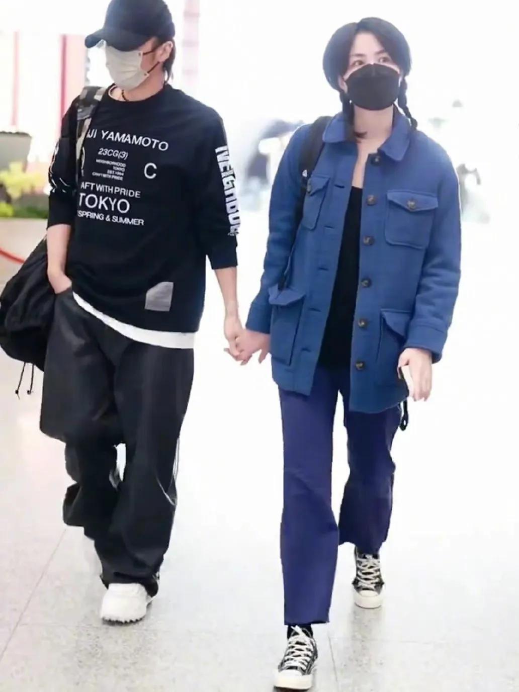 王菲谢霆锋世纪大复合大牵手图片,王菲谢霆锋牵手而行再现世纪牵手